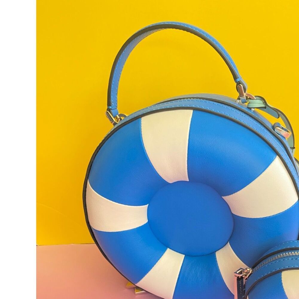 Kate Spade New York Pool Float crossbody bag is crafted from blue and white